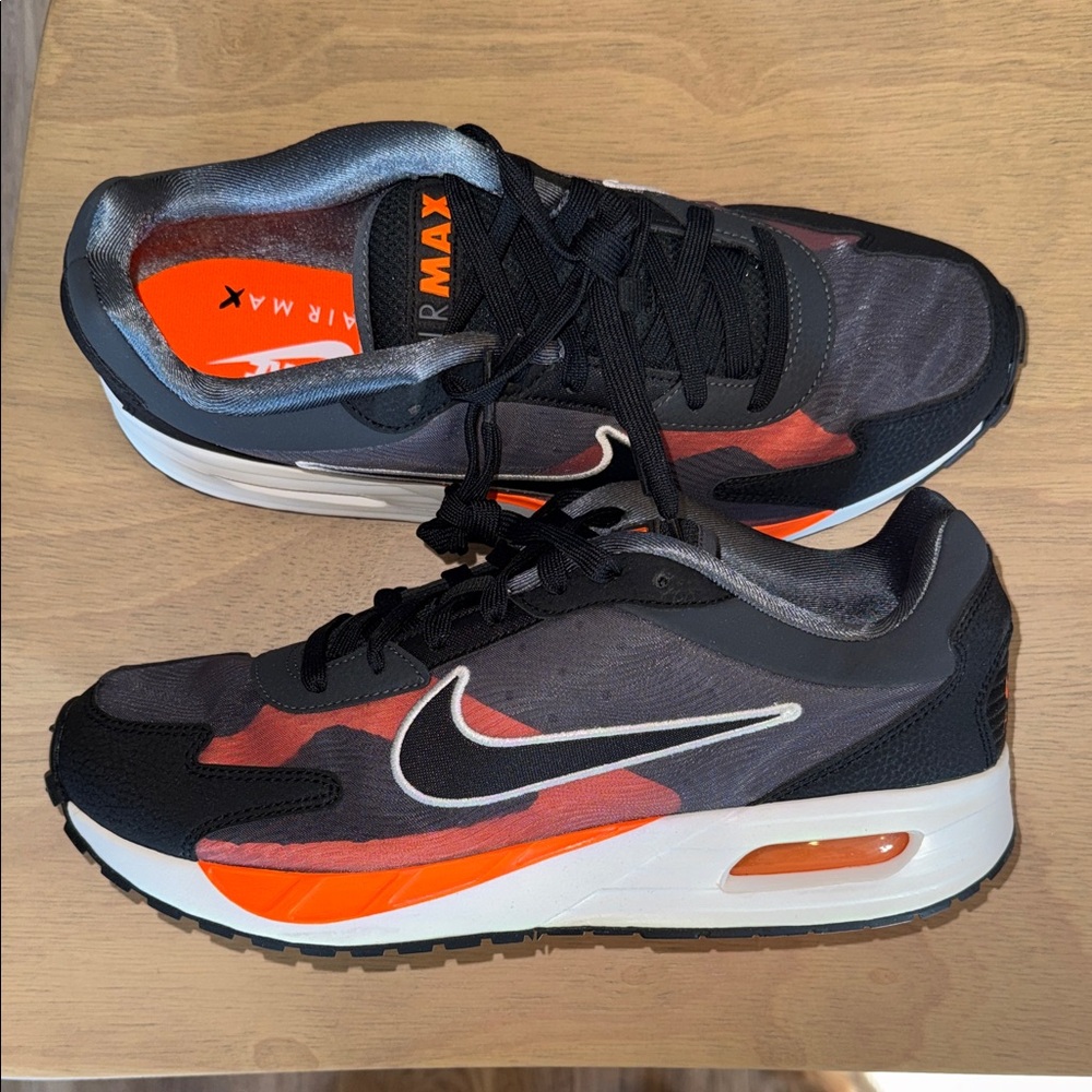 Nike Air Max Black Sneakers with Orange Accents and White Swoosh